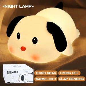 Squishy white silicone puppy night light with black ears, tap control sensor, and 30 minute timer box packaging