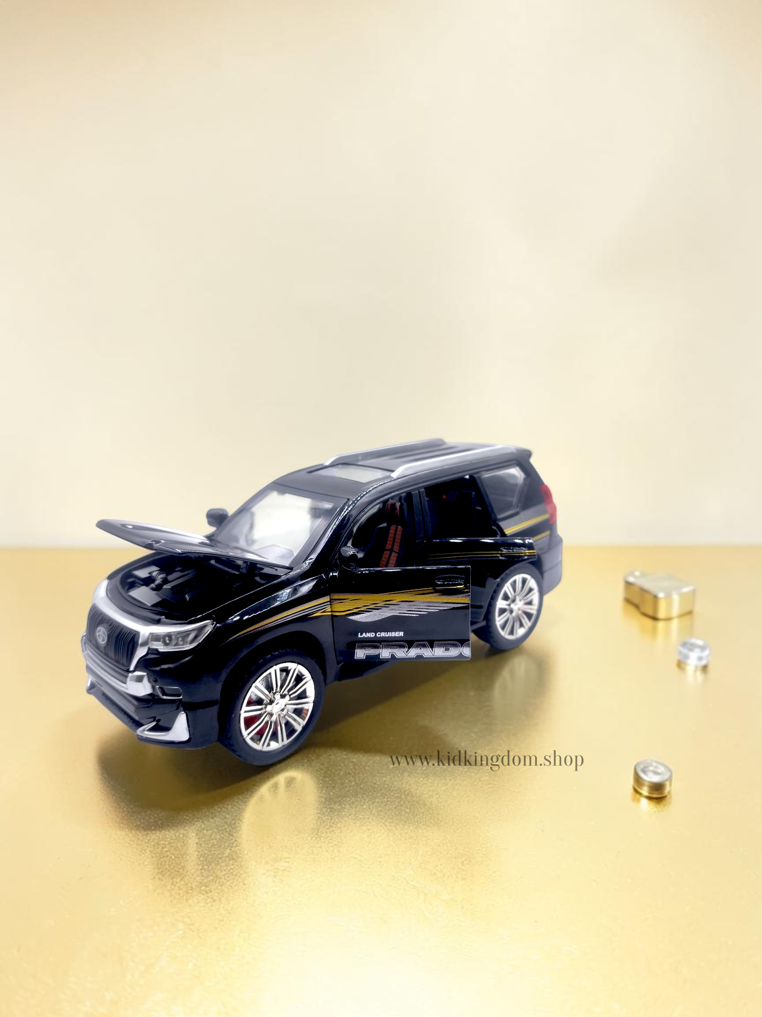 Black Toyota Prado SUV diecast car with openable bonnet hood showing engine, open doors, and pullback motor
