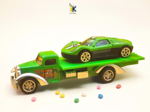 20260810_210752 Green vintage diecast flatbed tow truck carrying high speed green sports car