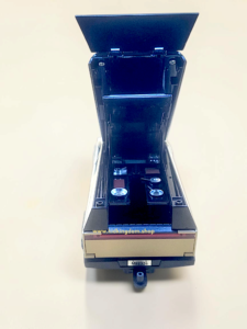 Close-up of detailed miniature bedroom and seating inside the openable diecast camper van toy