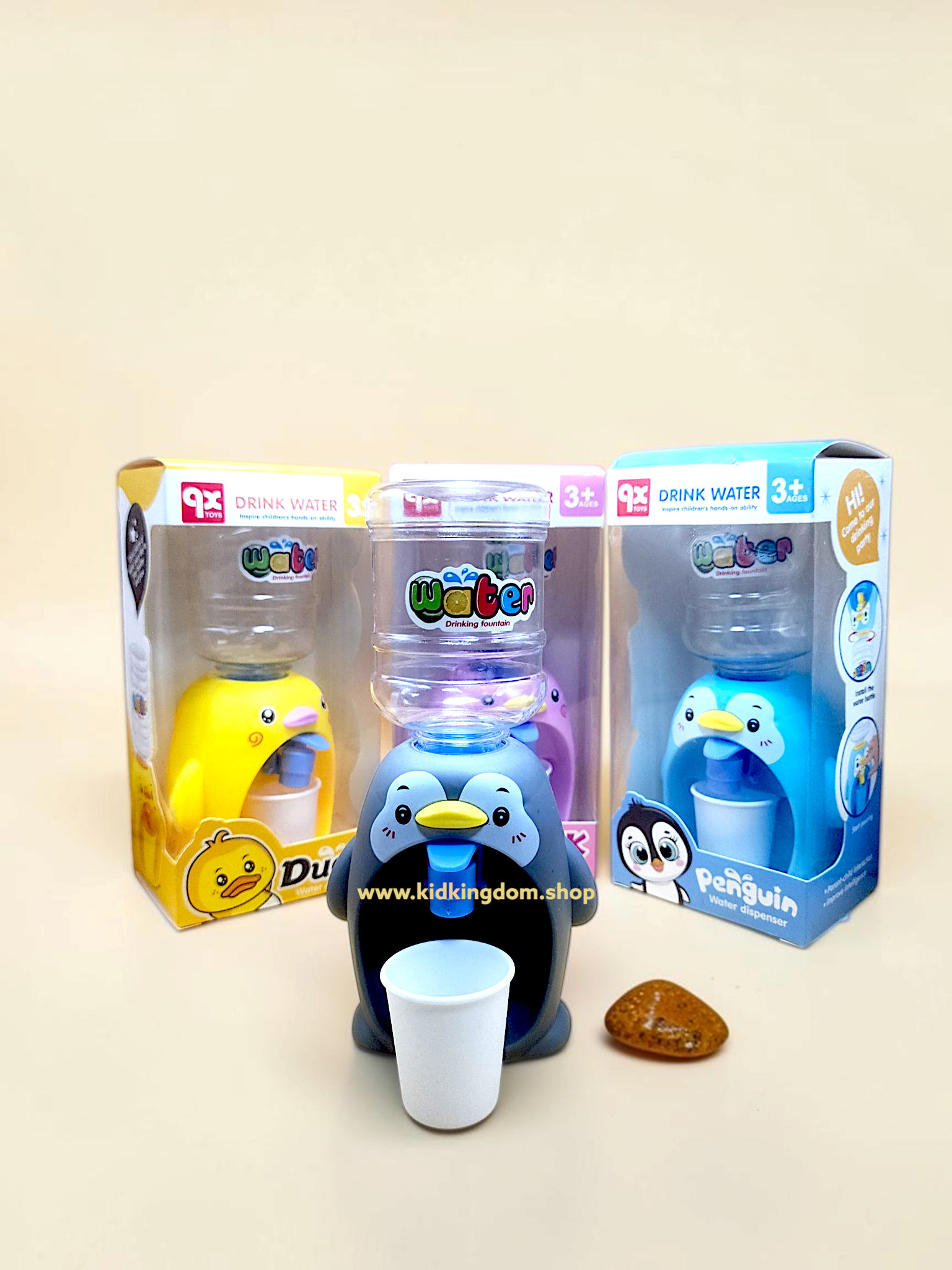 Boxed packaging display showing penguin and duck variants of mini water dispenser toys for kids