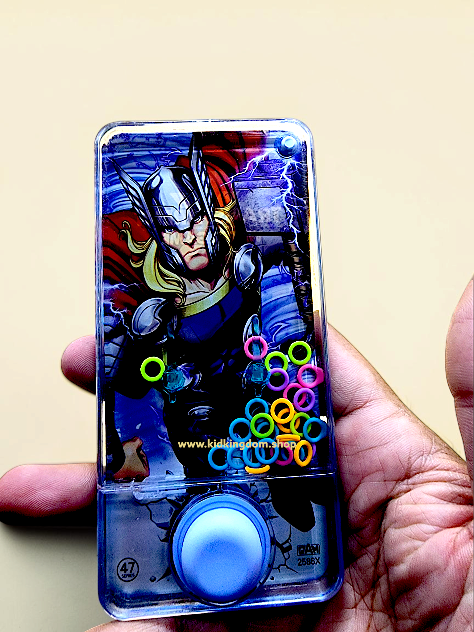 Close-up of Hulk character phone-shaped water game showing internal rings and push button
