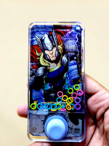 Sleek clear plastic profile of smartphone water arcade toy with vibrant character graphics