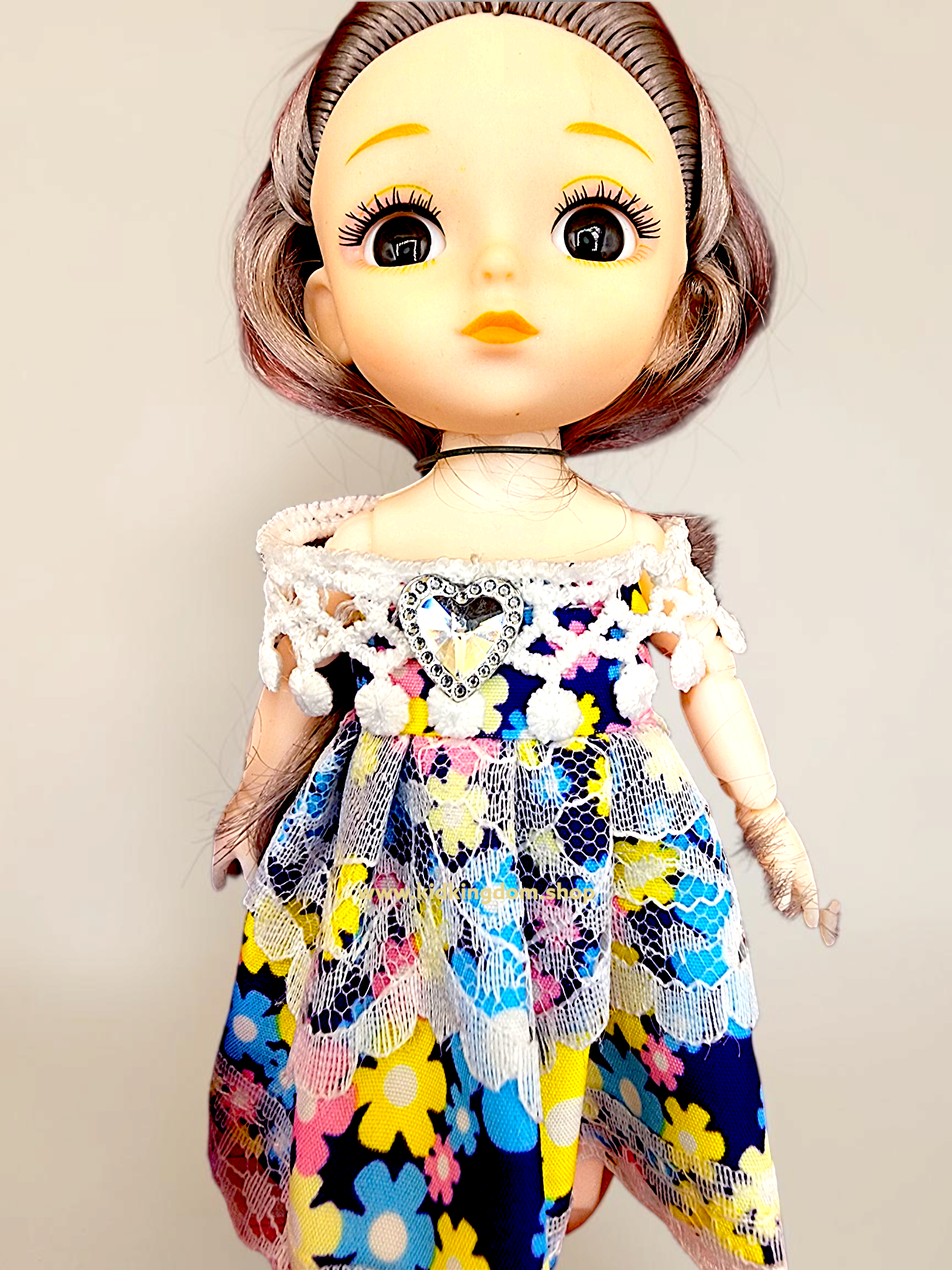 Detailed view of soft brushable hair and expressive big eyes on Kid Kingdom mini doll set