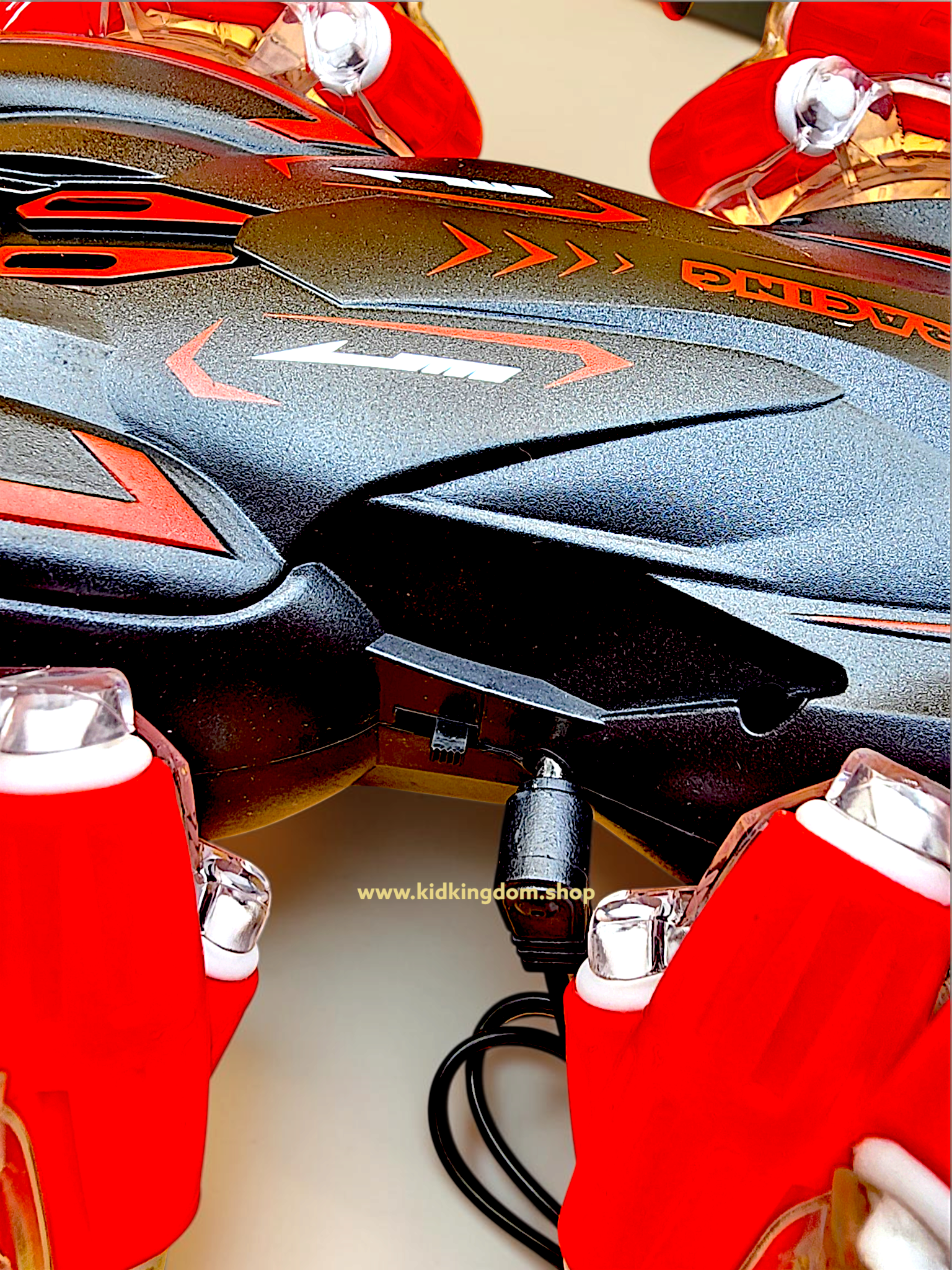 20260927_225858 Black and red RC stunt car showing red mecanum drift wheels and matching wireless controller