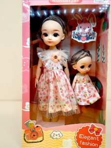 Silicone mother and sister doll set in pink window box packaging from Kid Kingdom