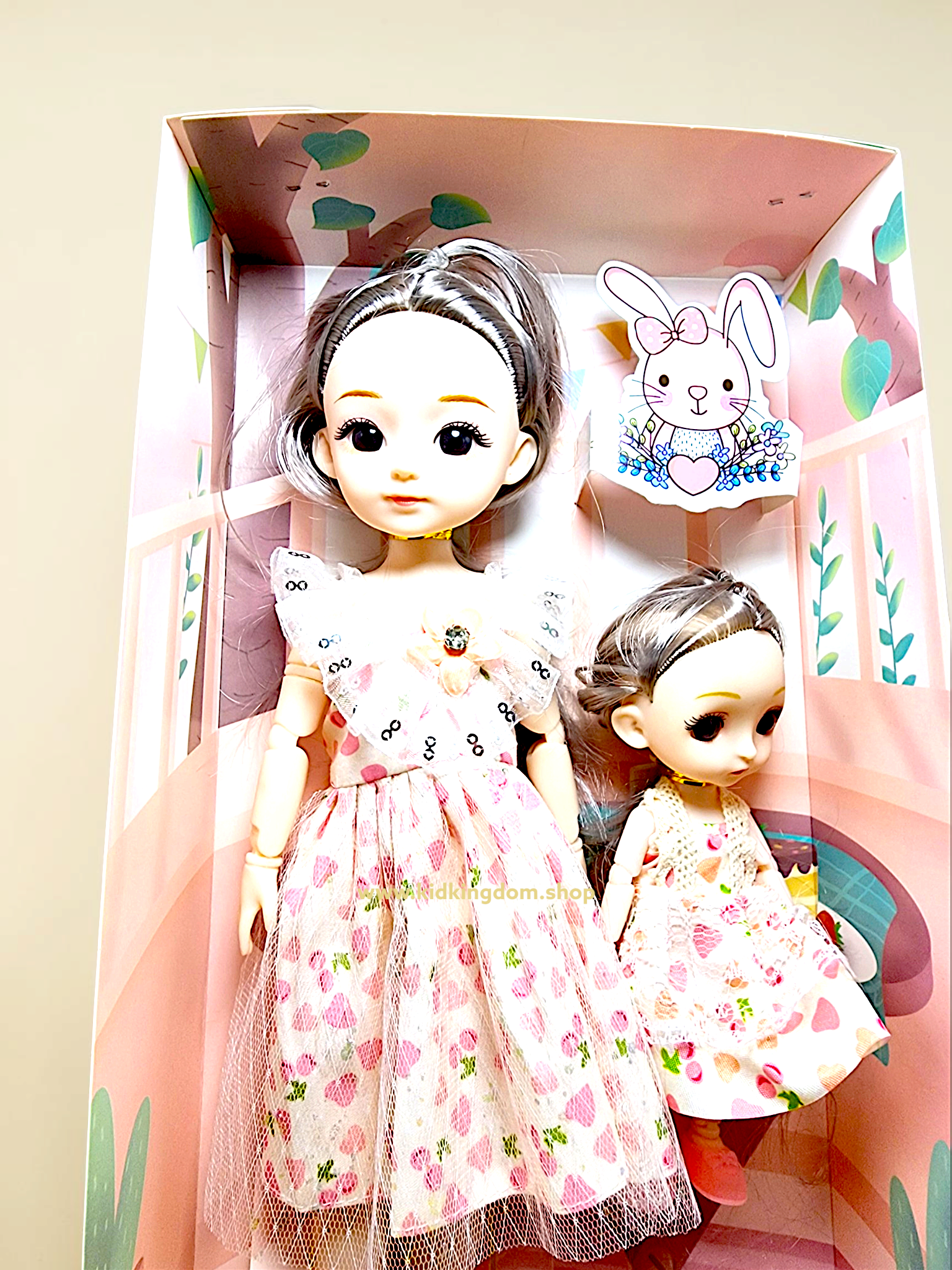 Close-up of sequined ruffle collar and lace trimming on mother and sister doll outfits