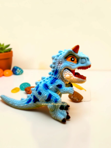 Flexible blue Carnotaurus dinosaur figure with realistic textured skin and roaring sound feature