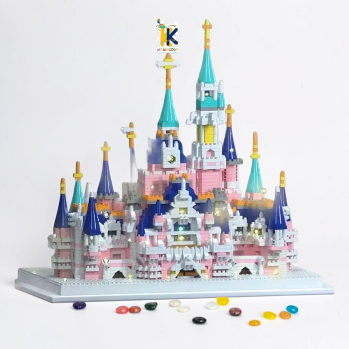 Night display view of fairytale palace model glowing with warm embedded LED string lights