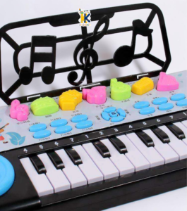 Child playing on 15 to 18 inch electronic piano keyboard with flashing lights and sheet music