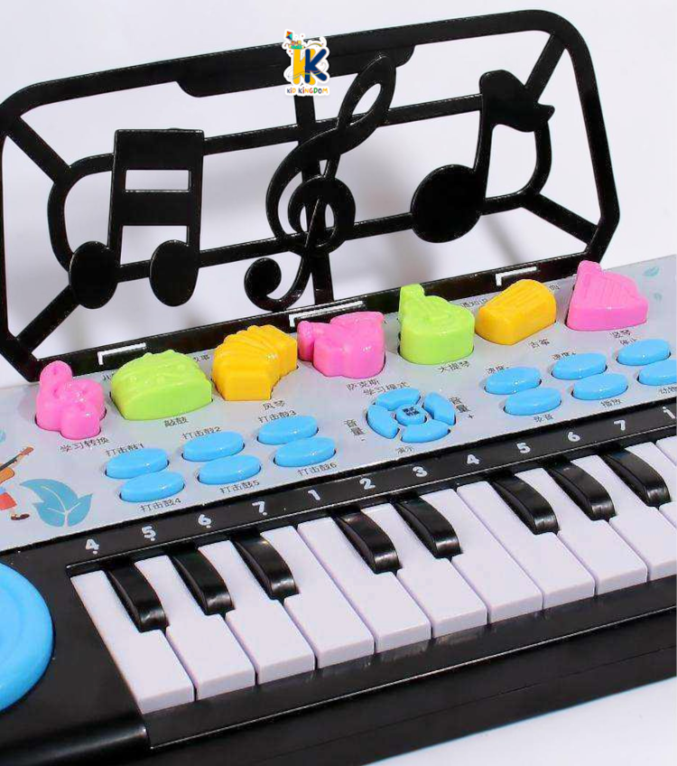 Child playing on 15 to 18 inch electronic piano keyboard with flashing lights and sheet music