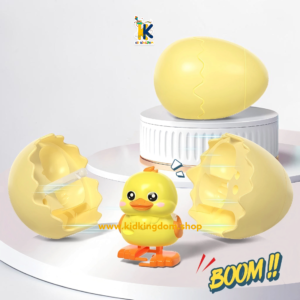 Image 2: Yellow wind up hatching egg popping open to reveal walking chick hatchling toy[cite: 18]