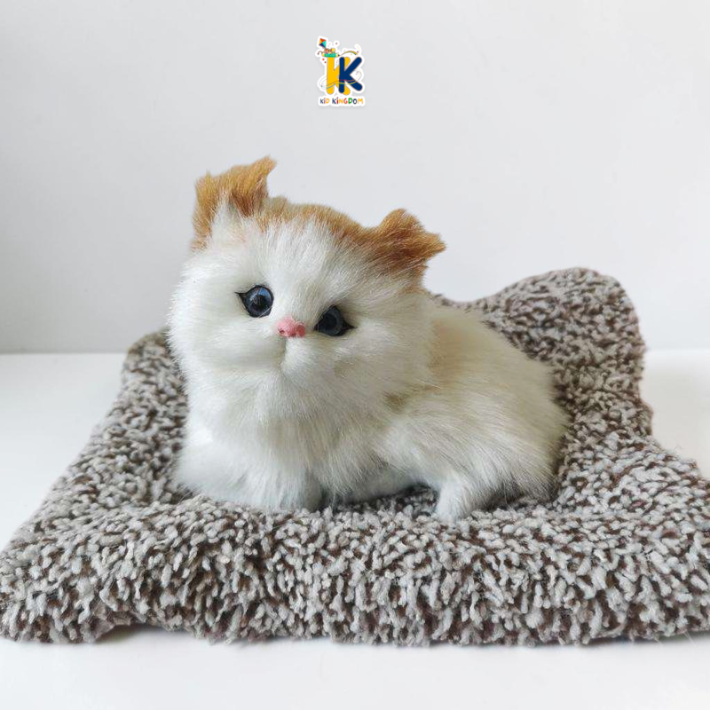 Image 1: Mini realistic white and ginger sleeping cat plush sitting on a grey plush mat cushion[cite: 19]