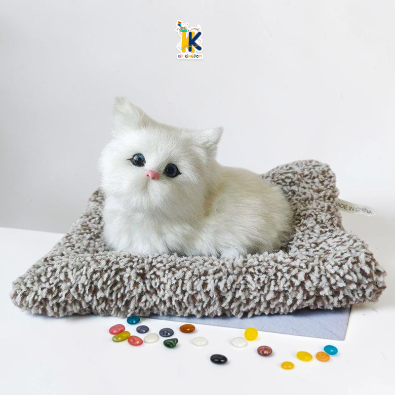 J3 Image 4: Child pressing the cushion mat on sleeping cat plush toy to activate meowing sound